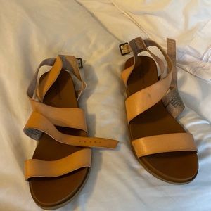 Tan AE sandals, small imperfection in on leather of one shoe
